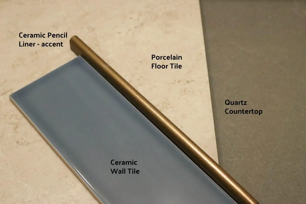 Bathroom material choices - blue tile, taupe floor tile, dark grey countertop