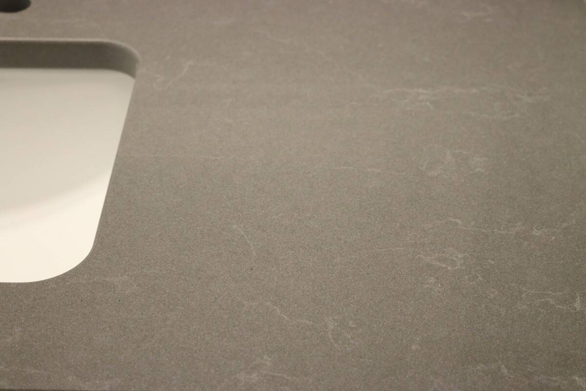 Dark grey quartz countertop with white sink material choices