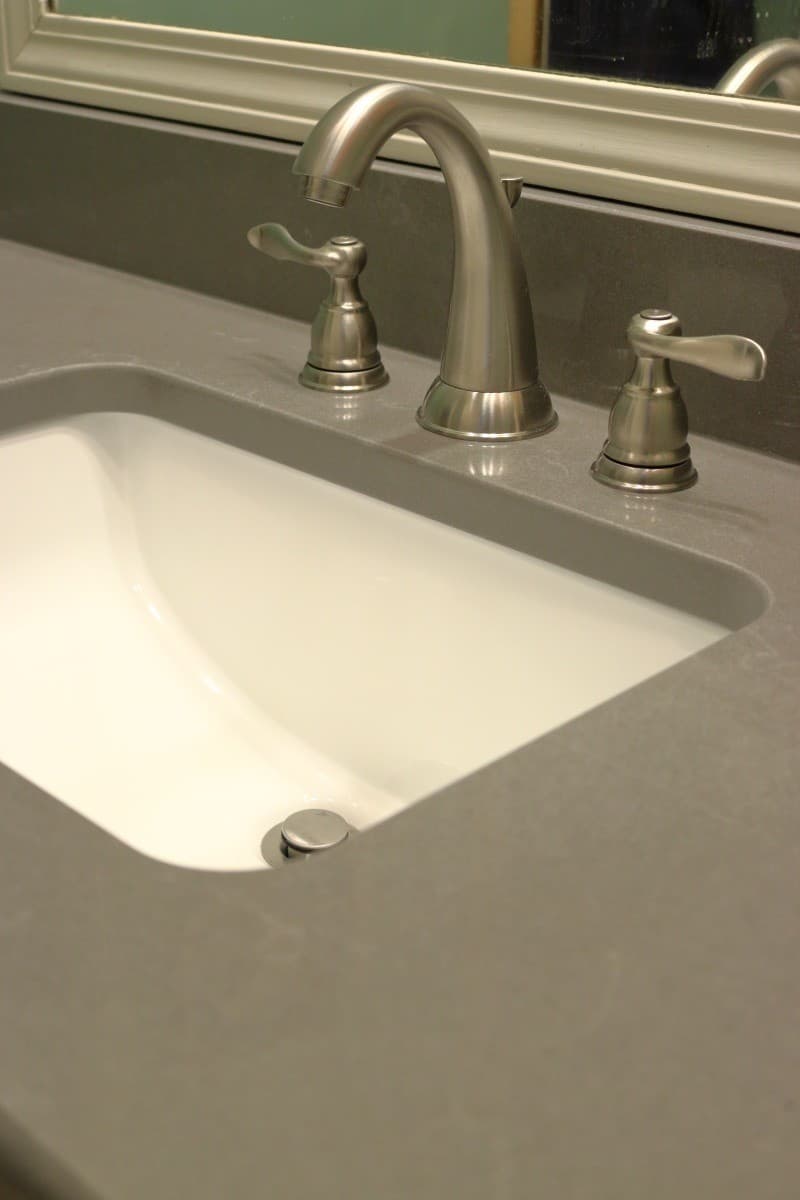 Bathroom remodel - dark grey quartz countertop with white sink