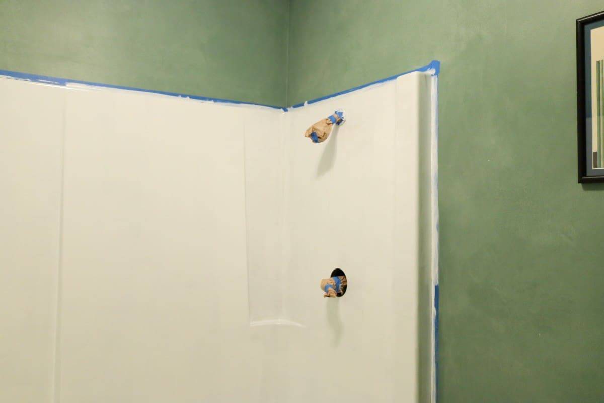 Photo of bathtub refinishing in progress - first coat of white paint