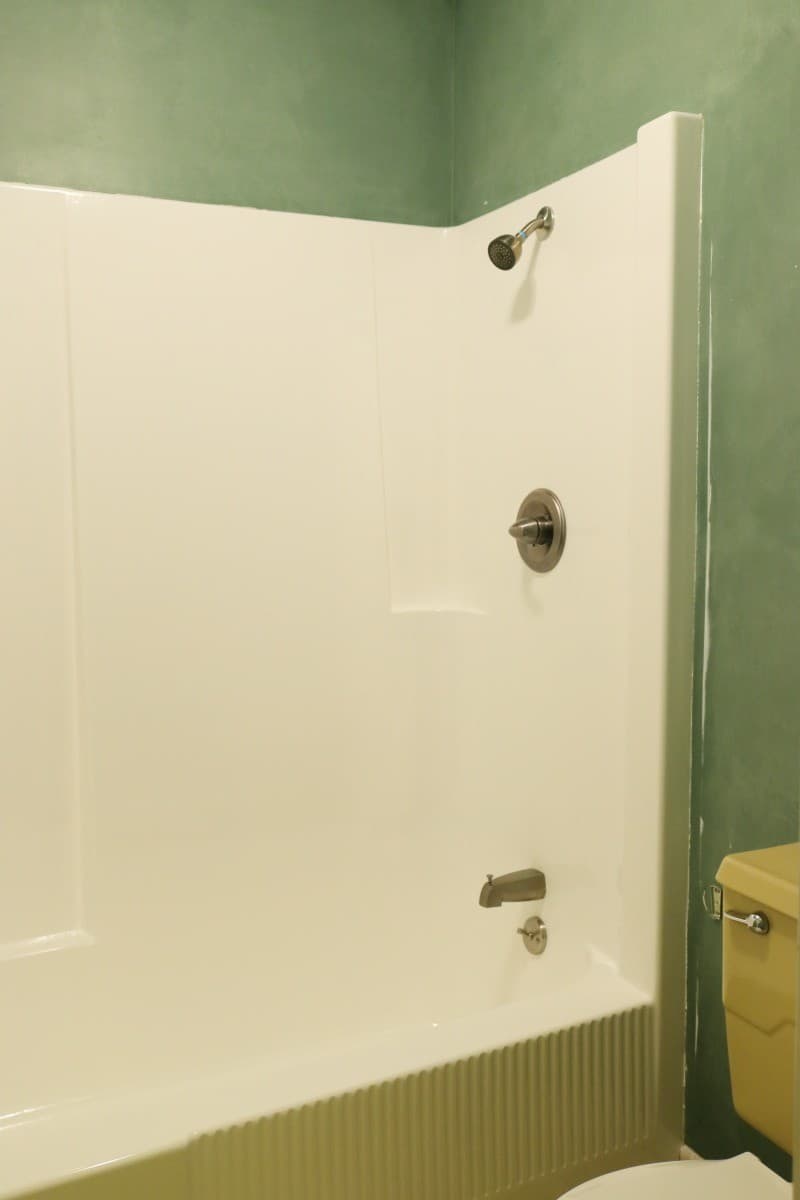 Photo of white fiberglass tub and shower after DIY refinishing