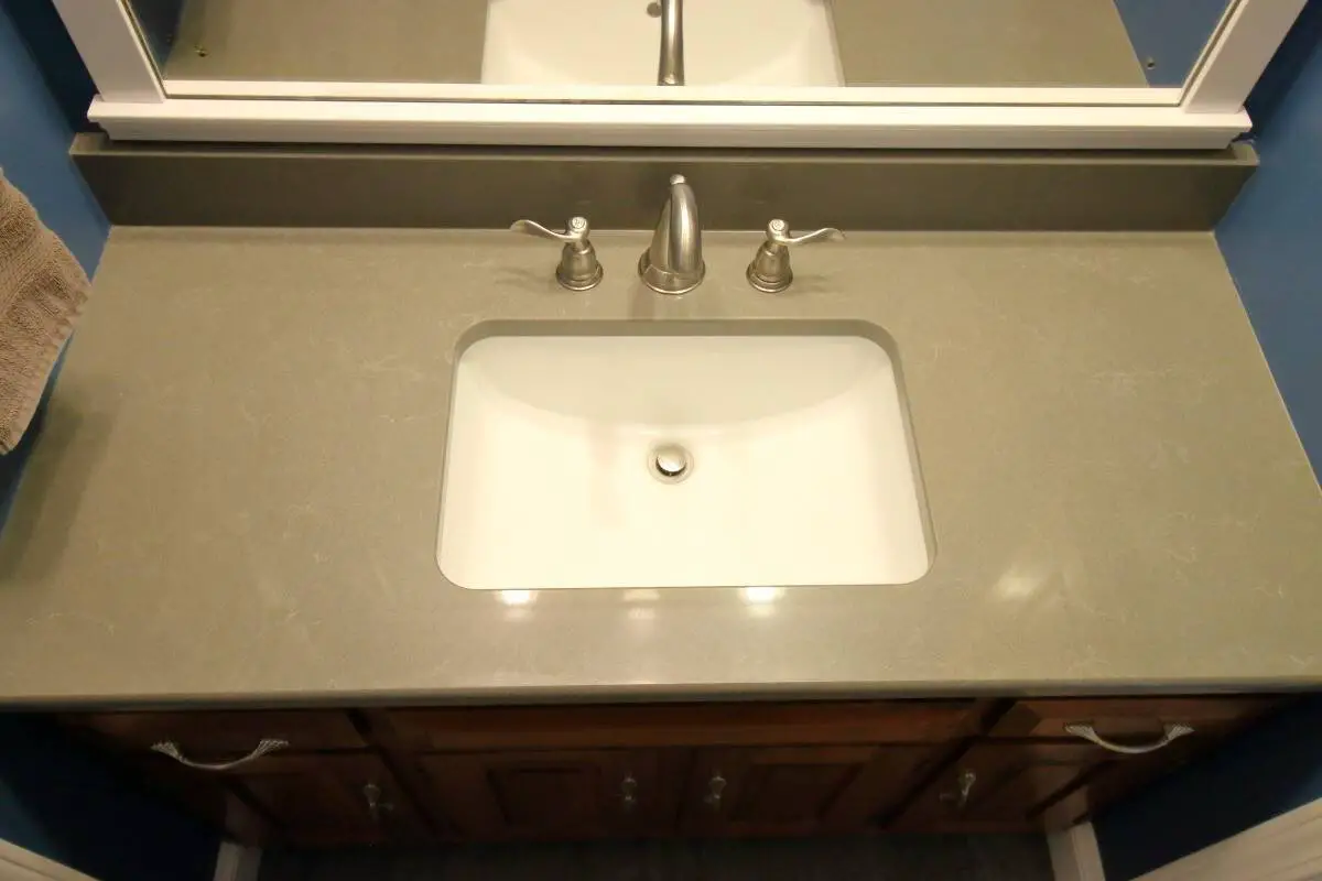 Dated 1970's Bathroom Remodeling - Bath Renovation Reveal 7 Dark grey quartz countertop, white rectangular sink, satin nickel faucets