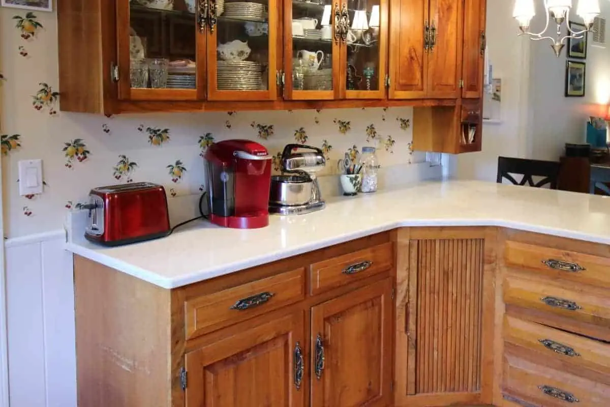 Kitchen remodel with hickory cabinets and white quartz countertop