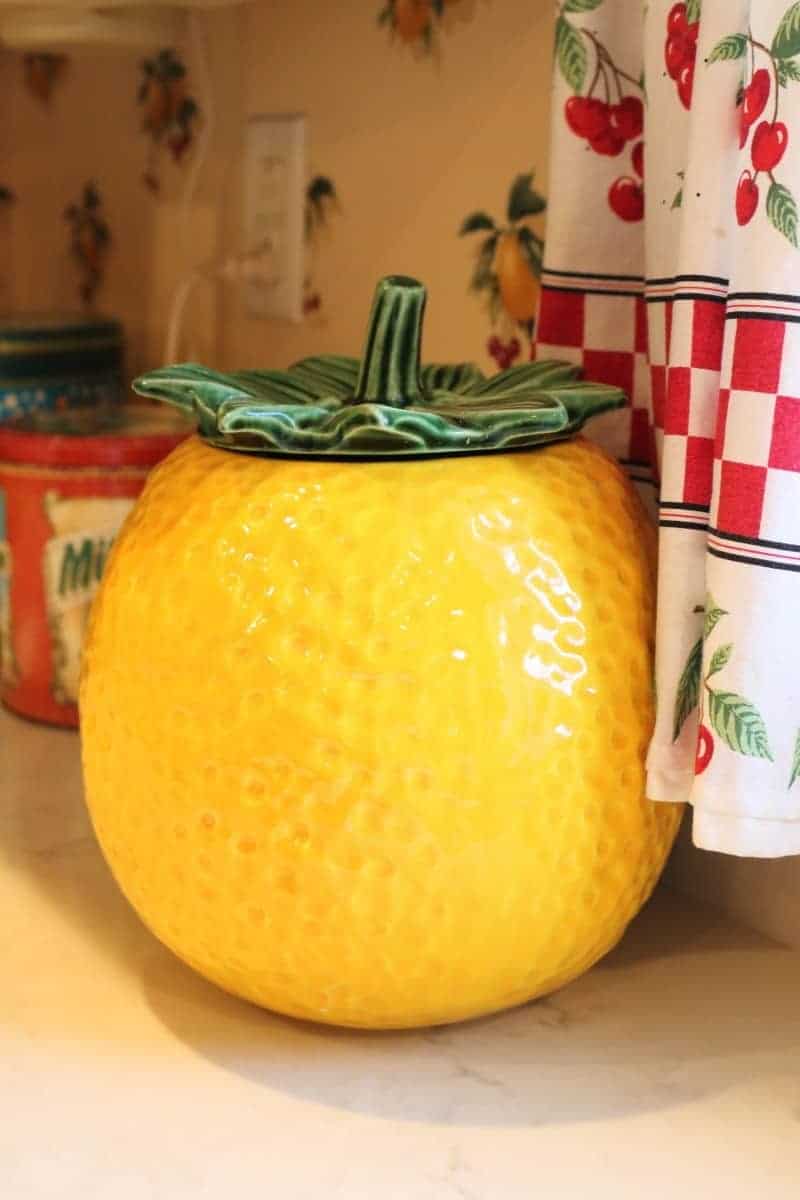 Bright yellow vintage cookie jar in the shape of a lemon