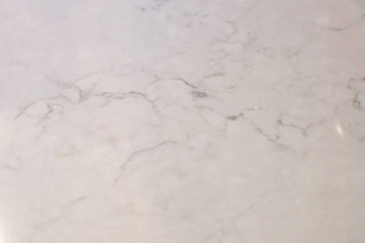 White quartz countertop with grey veining used in kitchen remodel