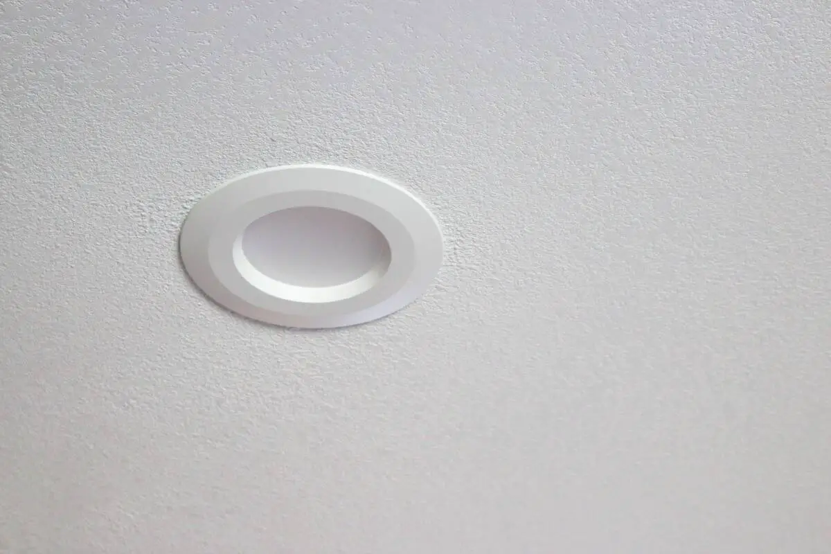 White textured ceiling with white recessed can light after kitchen remodel
