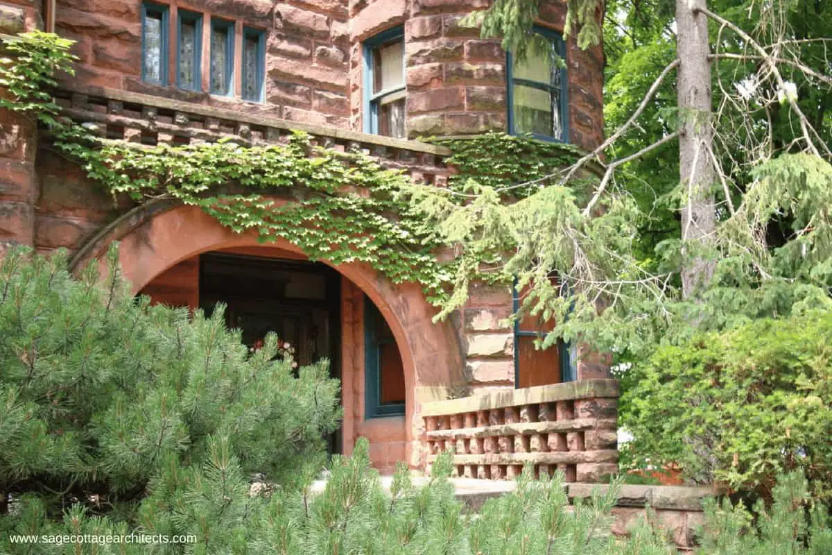 Like many Richardsonian Romanesque homes, the large arched entry porch is made of stone masonry.