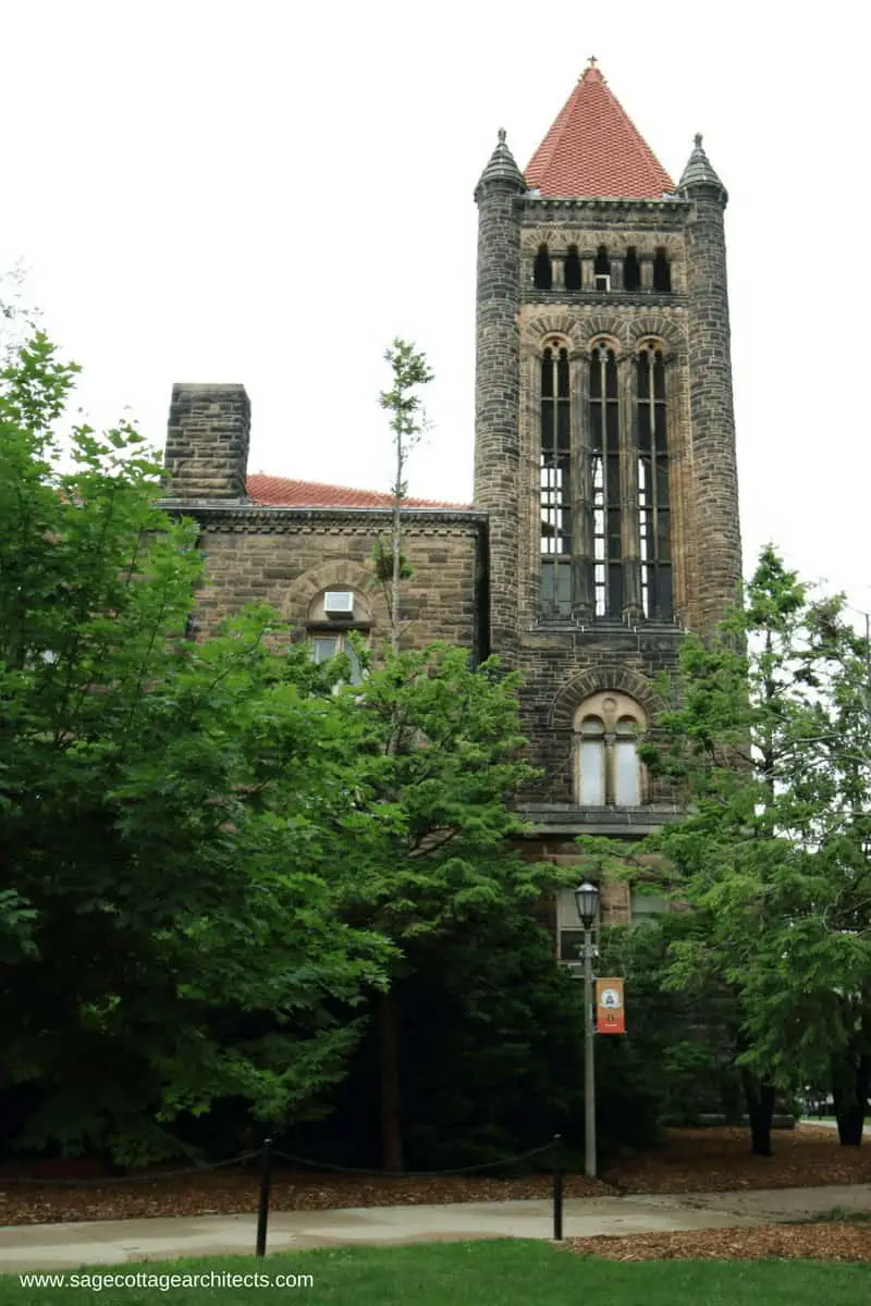 Stone bell tower with hipped roof on university campus