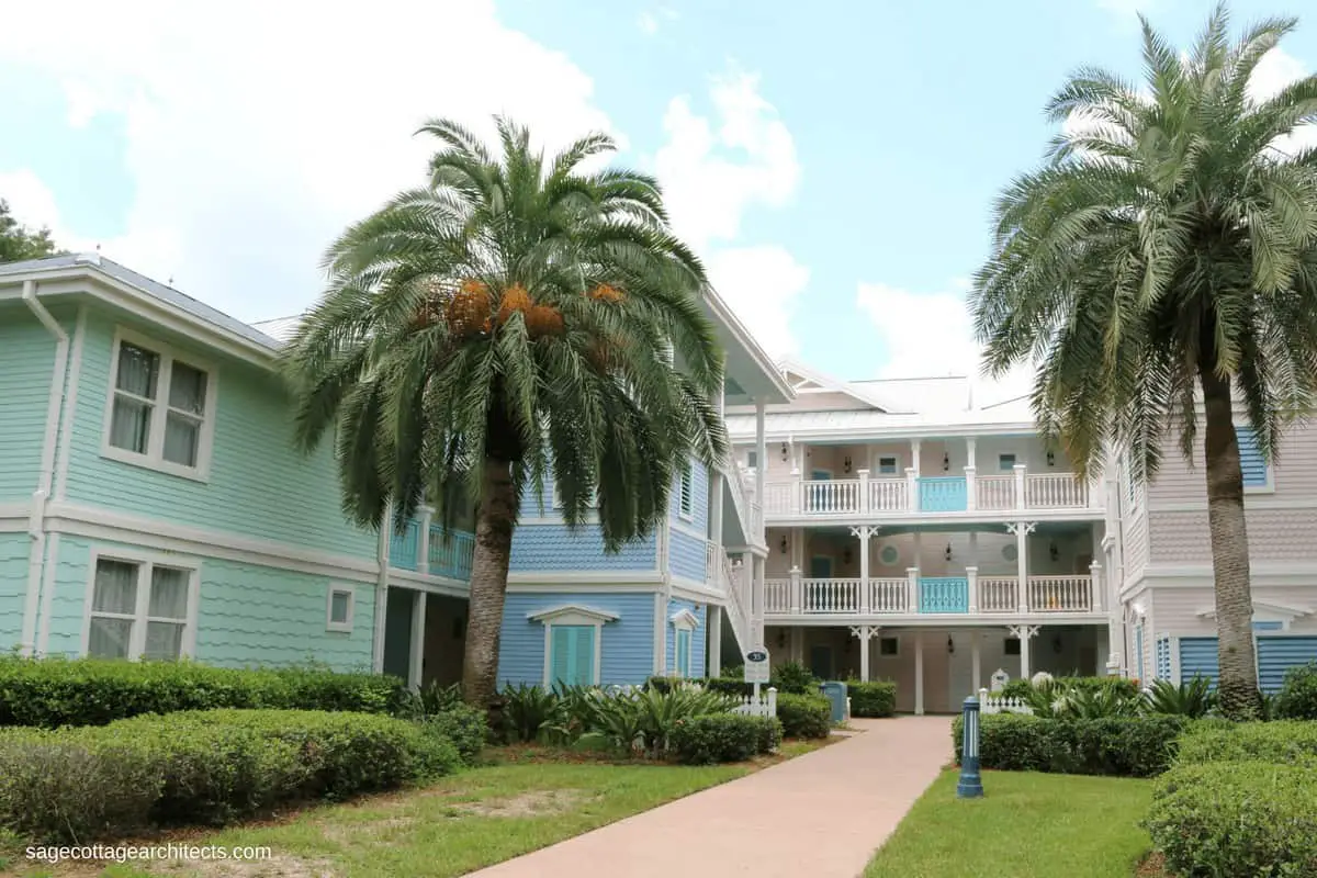 Green, blue, and pink pastel buildings with palm trees at Disney's Old Key West Resort.