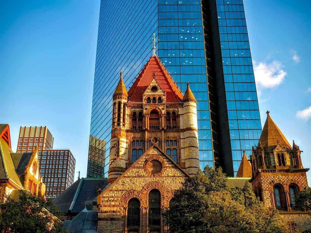 Richardsonian Romanesque homes are based on this stone church in front of modern skyscraper