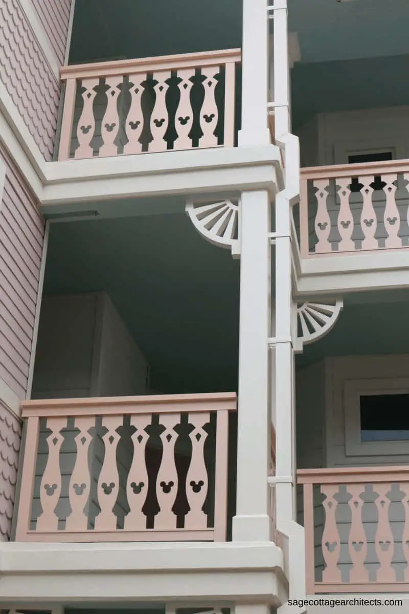 White gingerbread trim and pink balcony railings with Mickey Mouse cutouts at Disney's Old Key West Resort