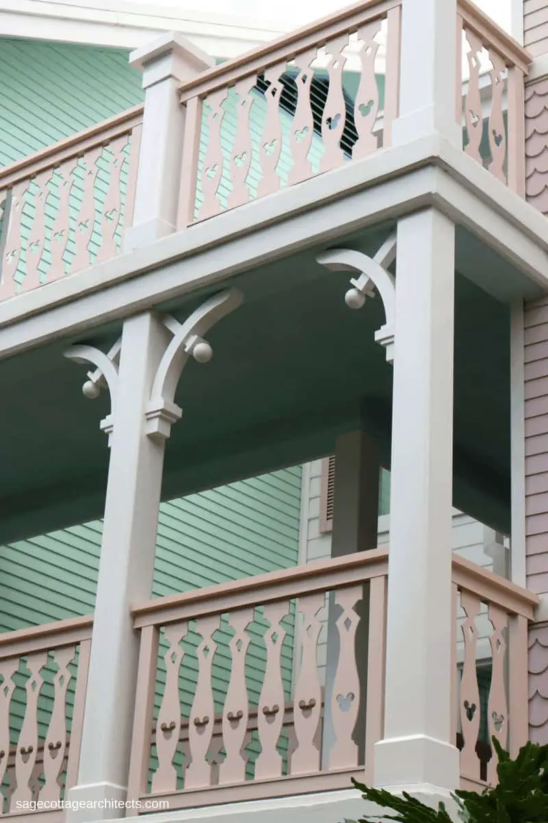 Disney's Old Key West Resort balcony with white gingerbread corbels and pastel pink railing.