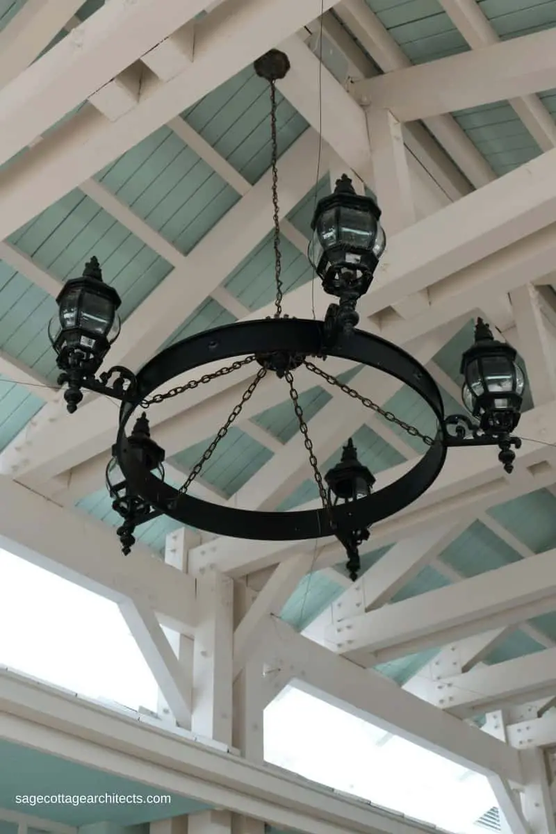 Large black ring light with 5 lanterns hanging from the ceiling at Disney's Old Key West Resort Hospitality House .