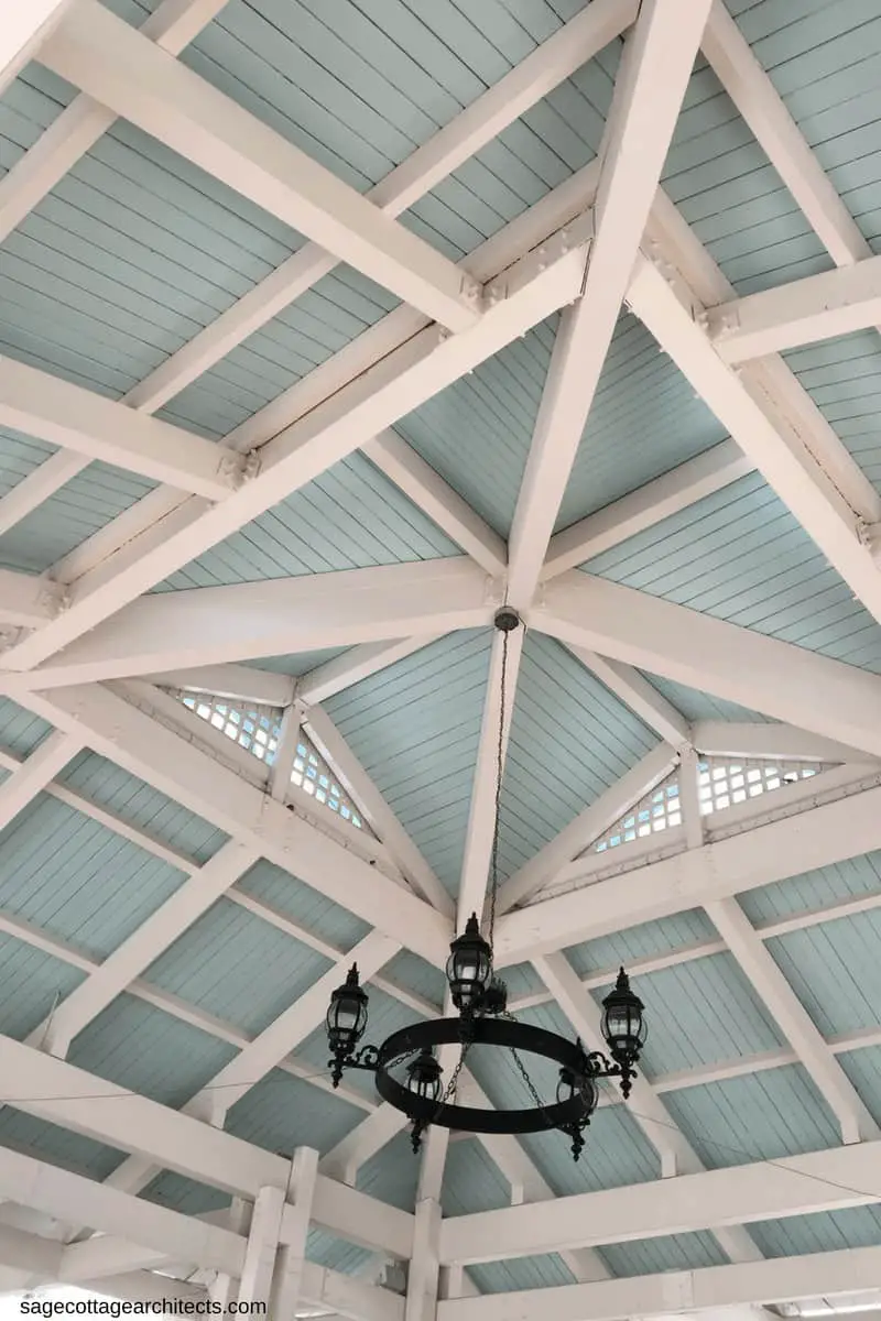 Exposed white rafters and blue wood slat roof of main entrance to Disney's Old Key West Resort.