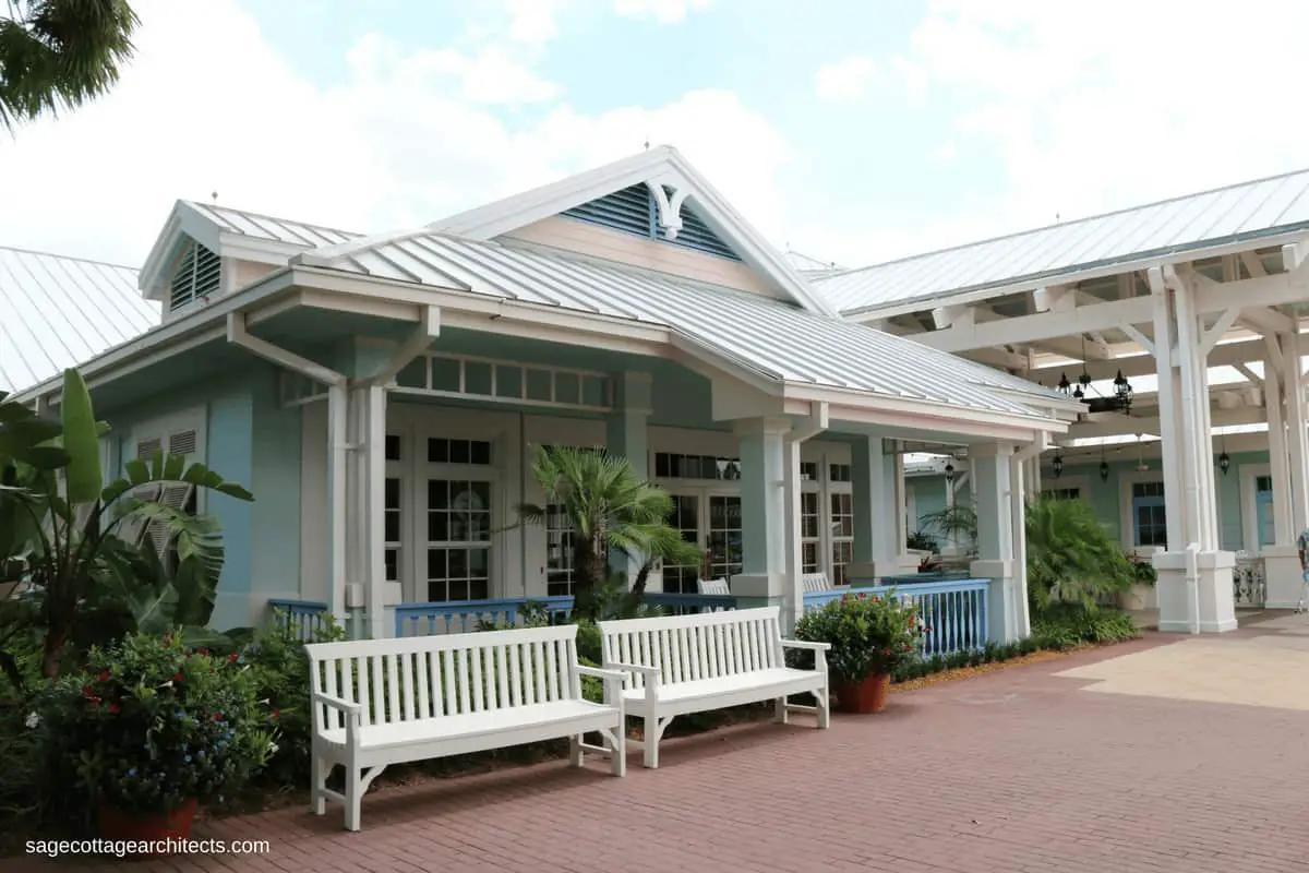 Pastel blue building, white gingerbread, grey metal roof at Disney's Old Key West Resort Hospitality House.