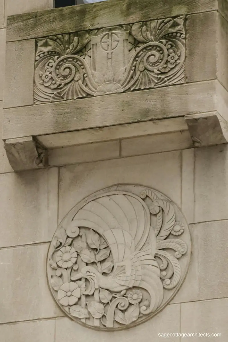 Art Deco hotel exterior in limestone, with carved decorative round panel of a bird and flowers
