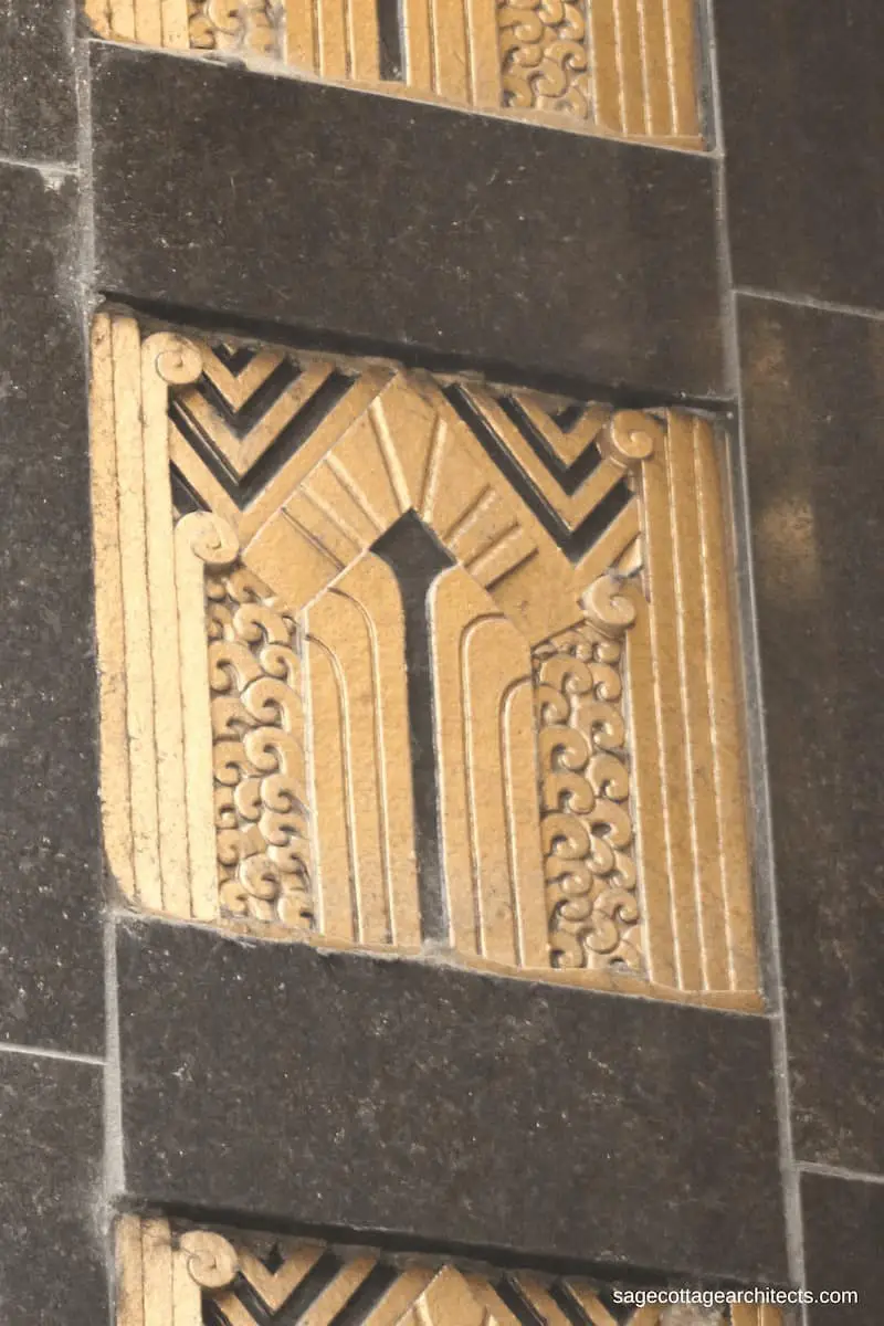 Black and gold Art Deco decorative panel with chevrons