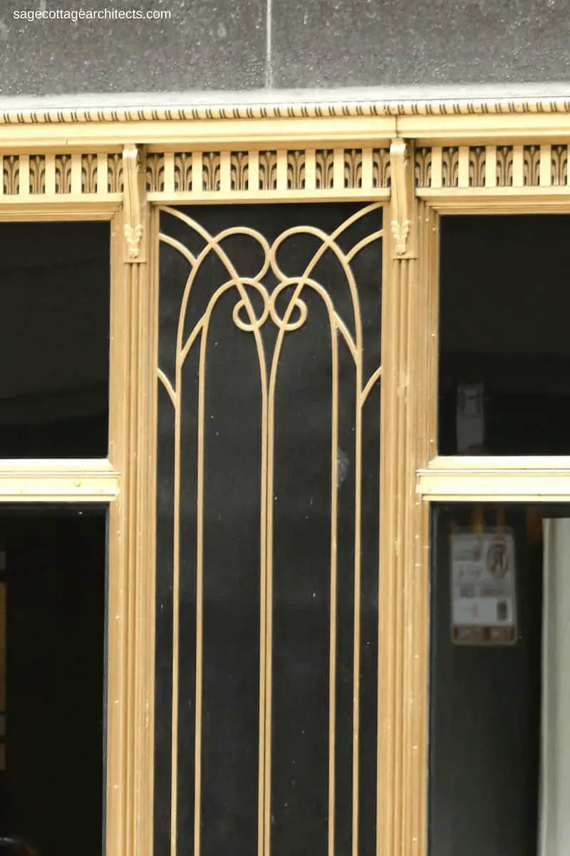 Art Deco bronze ornamentation on the glass storefront of the Carbide and Carbon building.