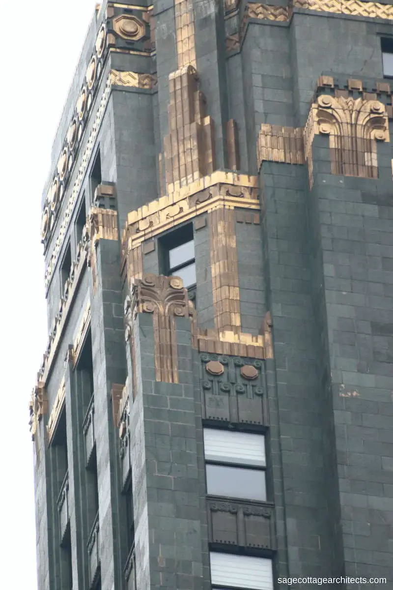 Bronze Art Deco details on dark green terra cotta walls of the Carbide and Carbon Building.