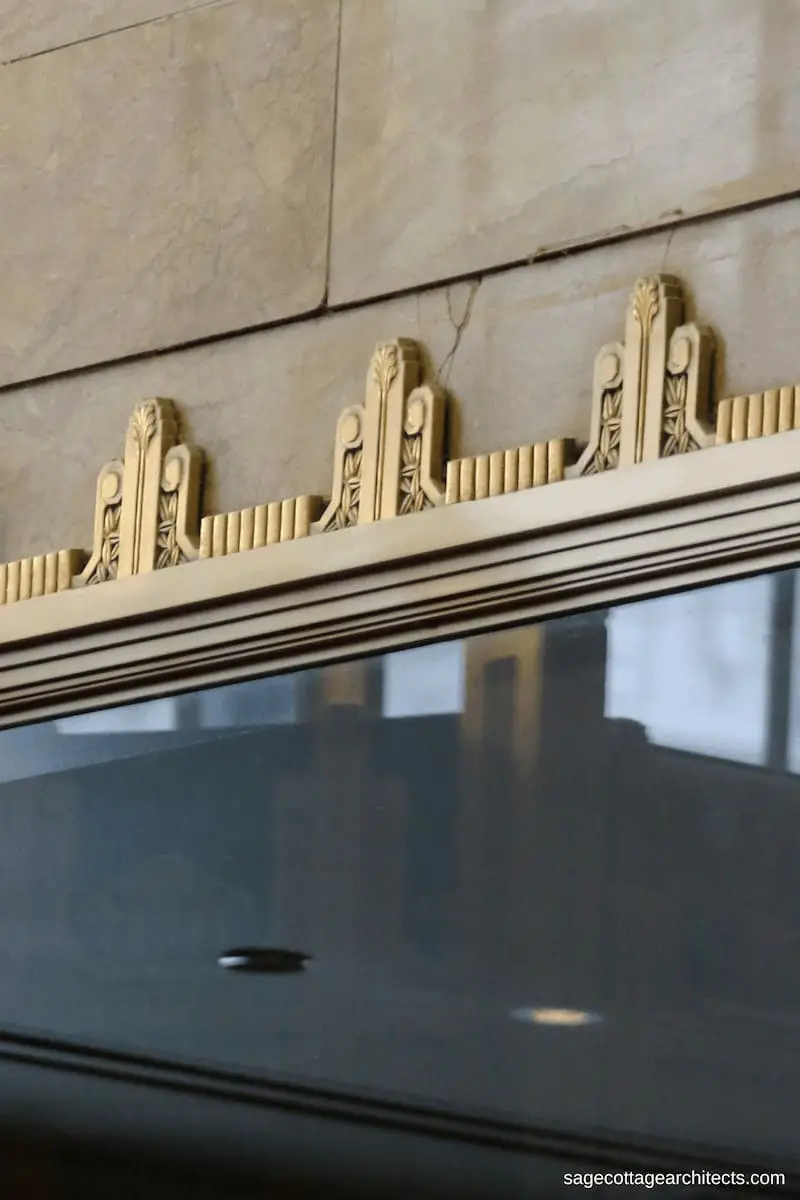 Bronze Art Deco details with black marble and tan marble walls in the lobby of the Carbide and Carbon Building. 