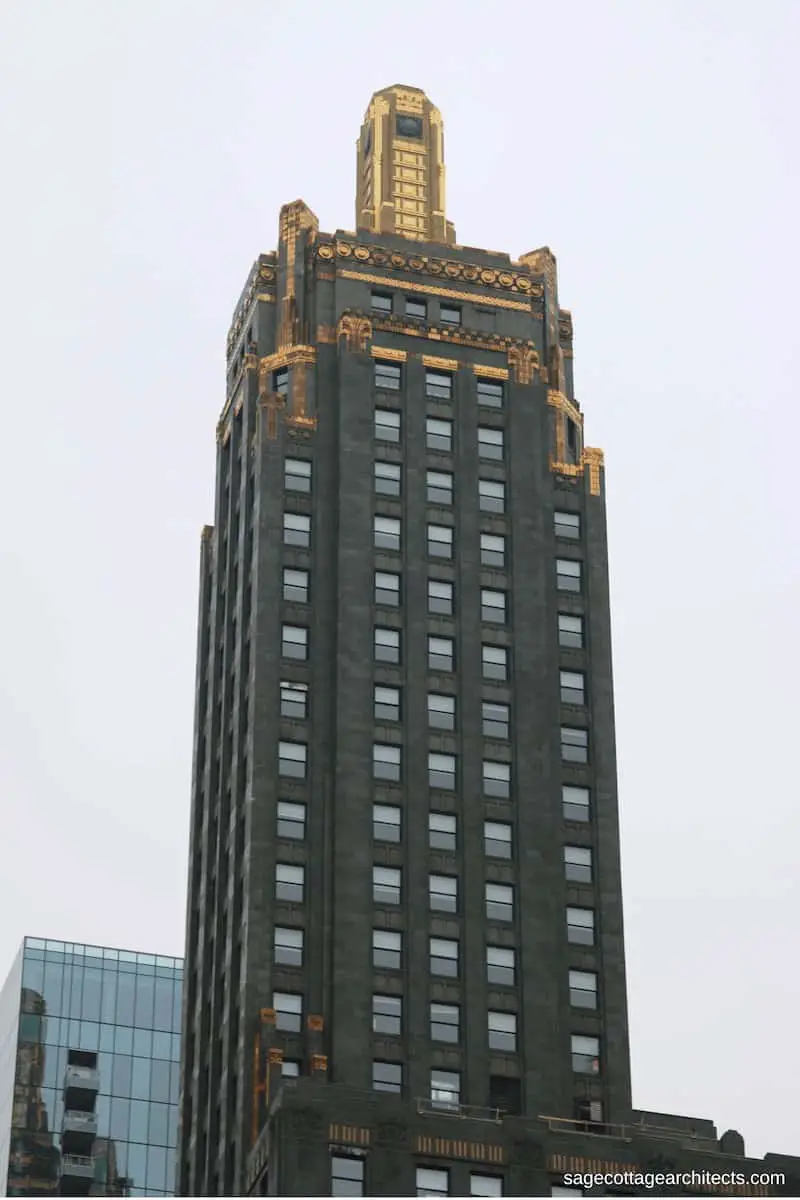 Dark grey Art Deco Carbide and Carbon tower with bronze ornamentation and gold beacon