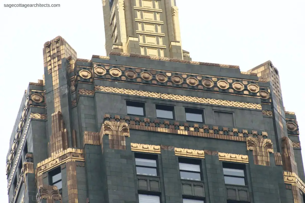 Dark green terra cotta Carbide and Carbon Building tower with bronze Art Deco ornamentation.