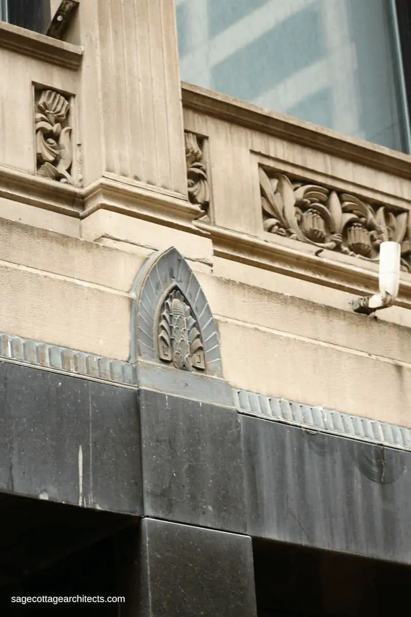 Limestone wall with black granite carved Art Deco shield