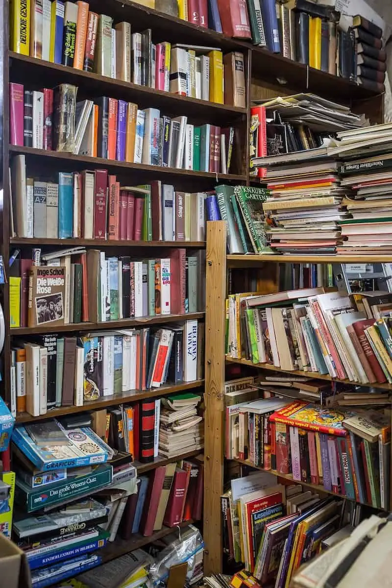 Built-in bookshelves overflowing with books.