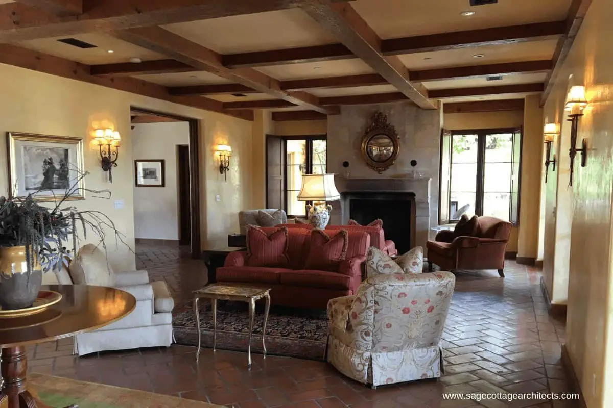 Photo of living room with tile floors and wood beams