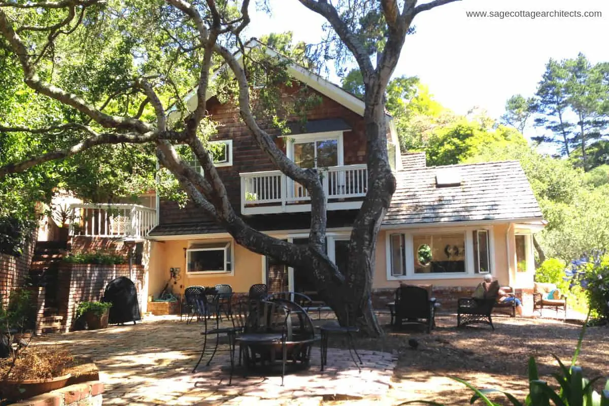 Photo of vacation rental home with large tree.