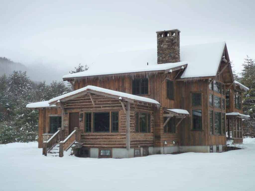 Exterior photo of a ski vacation home rental in the snow.