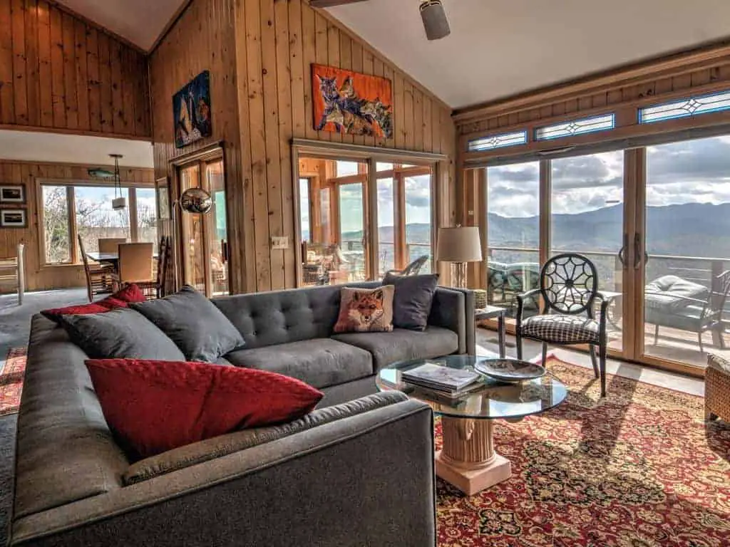 Picture of the interior of a ski vacation home looking out to the Smoky Mountains.