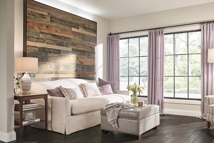 Photo of living room with wood accent wall.