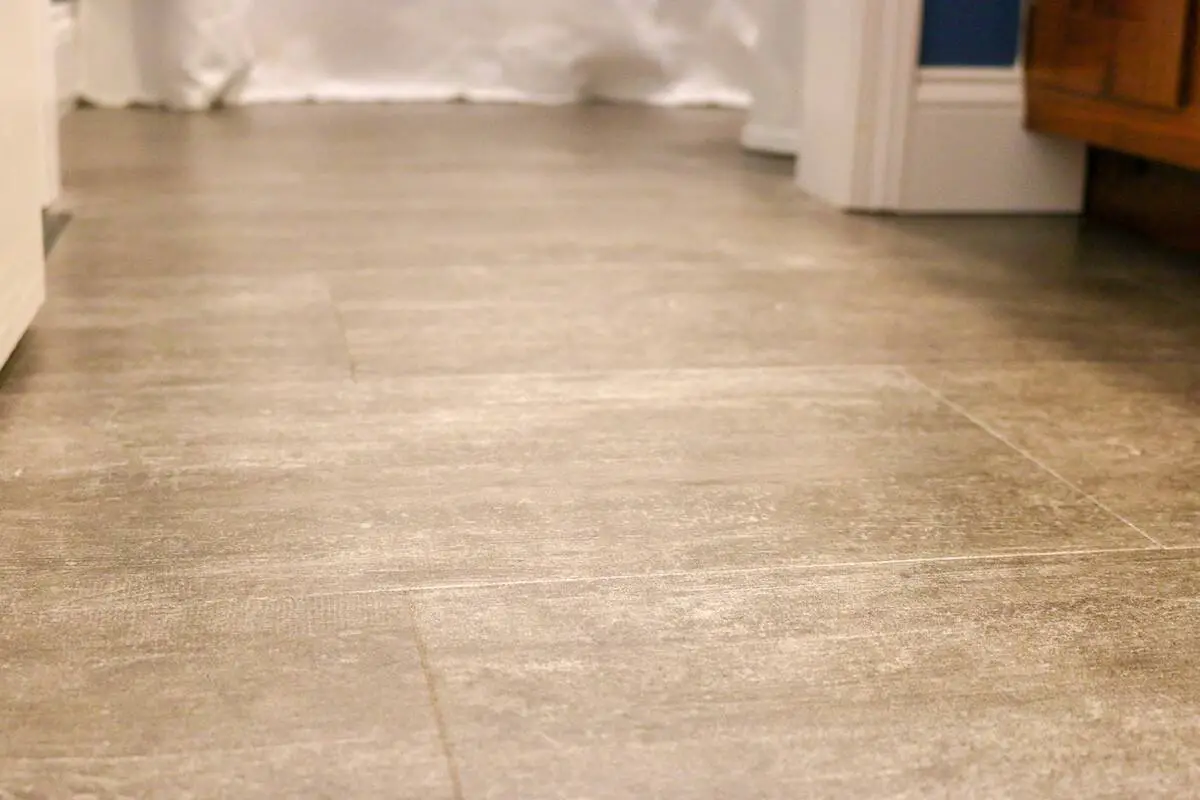 Photo of luxury vinyl tile grey floor in a bathroom