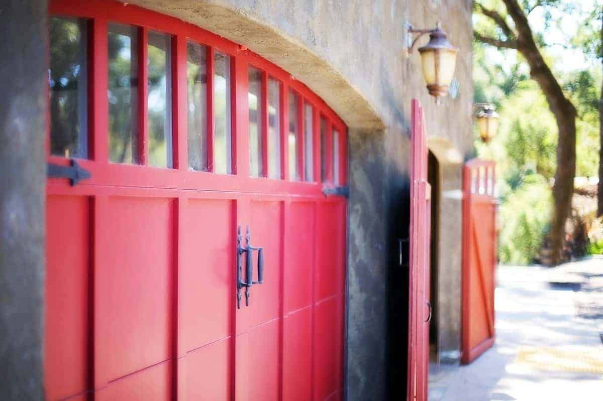 Photo of a red carriage doors that would look great in garage conversions.