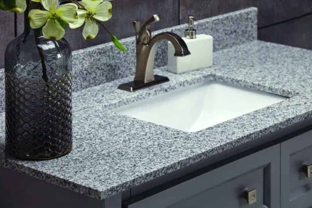 5 Simple Steps to Revitalize Your Bathroom Vanity 4 Photo of dark grey bathroom vanity.