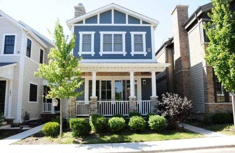 5 Ways to Add Curb Appeal to Your Home 4 Photo of blue home with white trim and front porch.