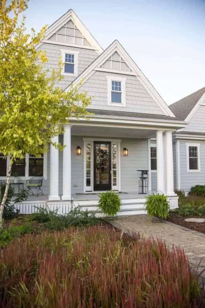 5 Ways to Add Curb Appeal to Your Home 9 Photo of farmhouse style home with large front porch.