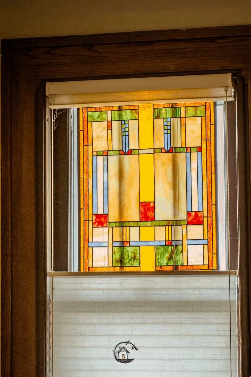 Photo of yellow, green, and red stained class window seen on Old House Society Tour.  