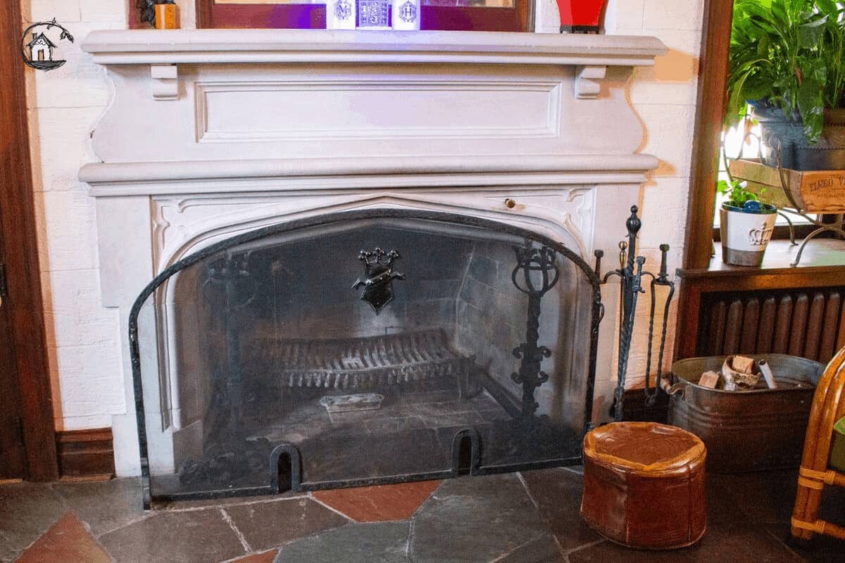 Photo of a white fireplace with trim work, seen on the old house tour. 