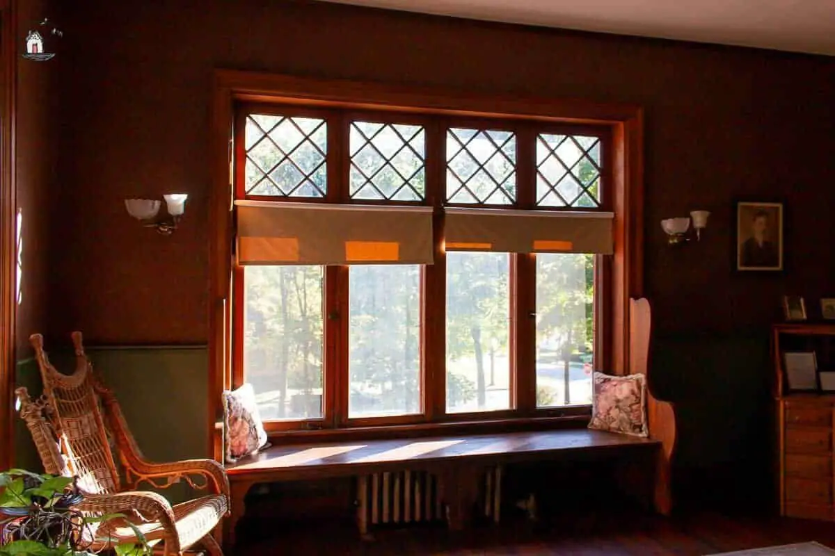 Photo of four windows with diamond panes in the study of the Vrooman Mansion. 