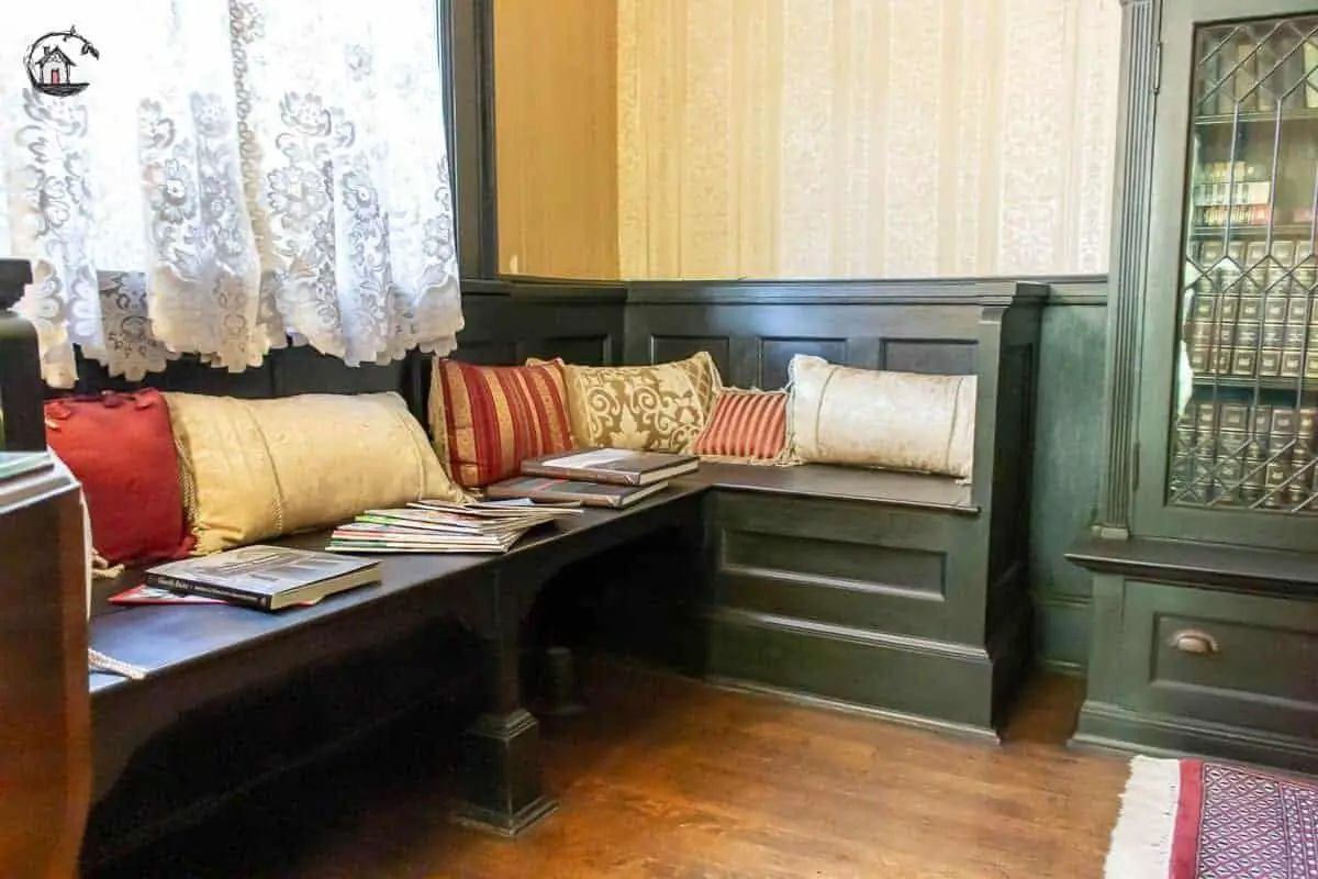Photo of builtin bench and bookcase in the second floor library of the Vrooman Mansion. 