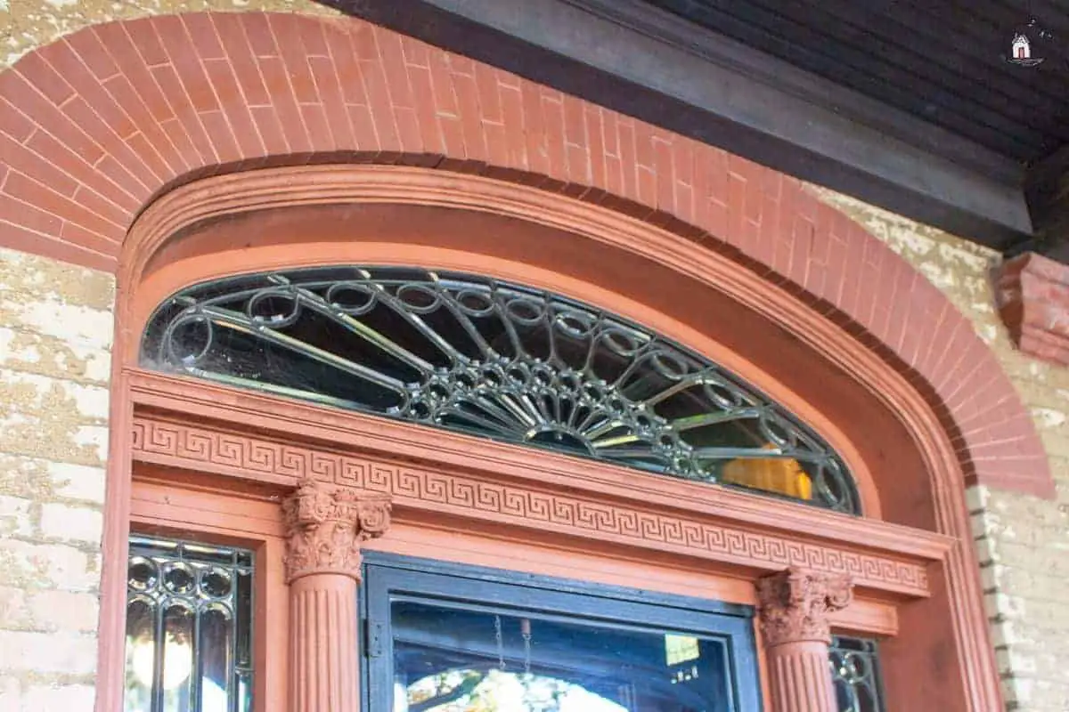 Photo of the front door transom window leaded glass on the Vrooman Mansion. 