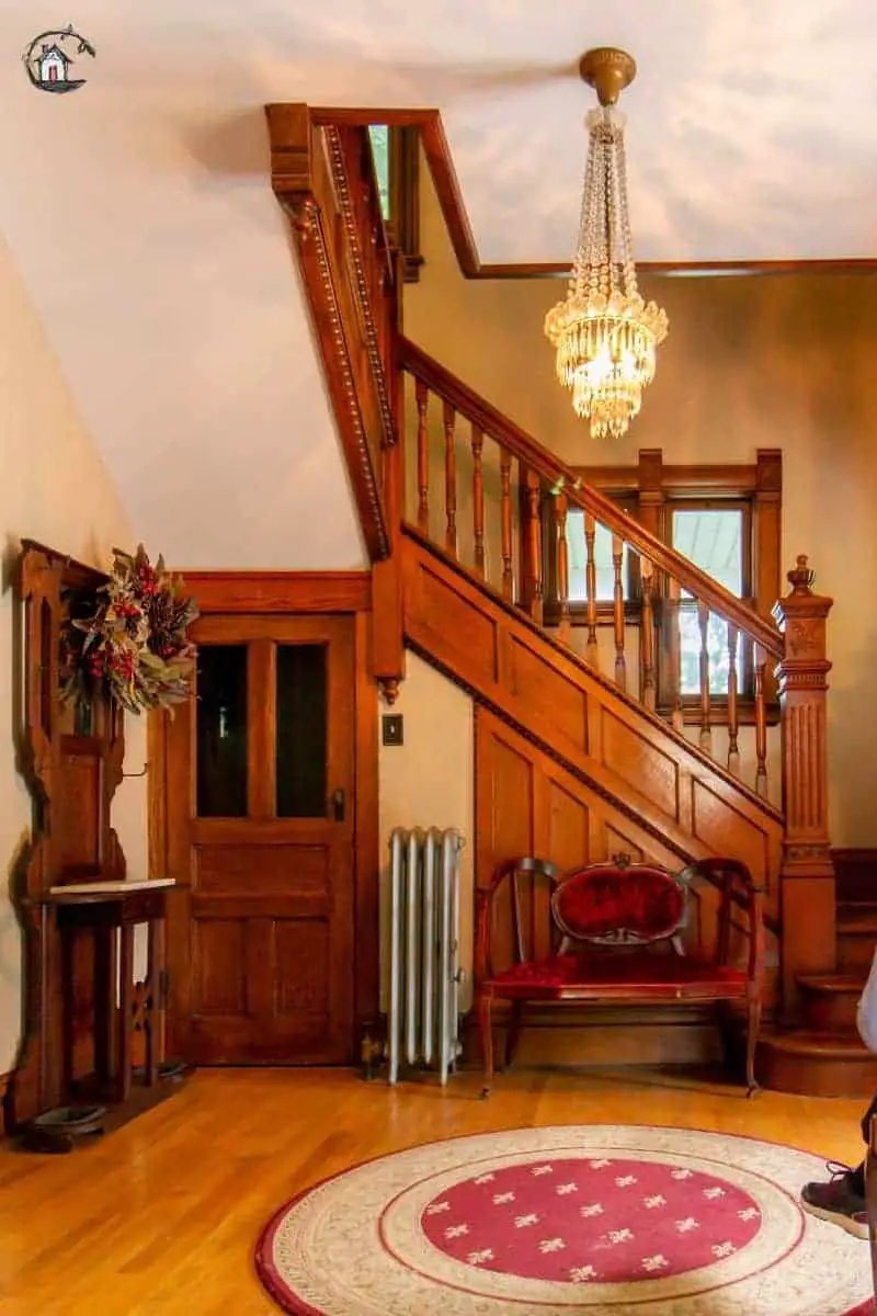 Photo of the interior entry and stairway of an old house. New houses can look to the design of older homes for inspiration. 