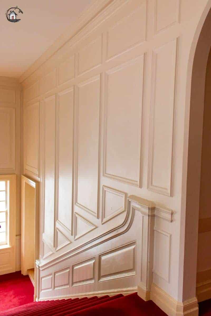 Photo of a paneled stairway in an old house. Old homes can teach new houses many important lessons. 