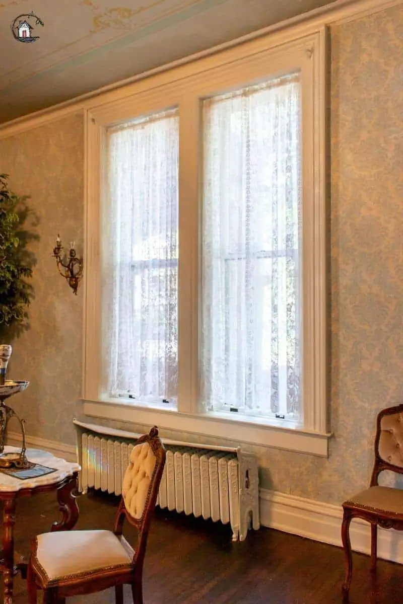 Photo of large windows on an old house. New houses can learn a lot from old ones. 