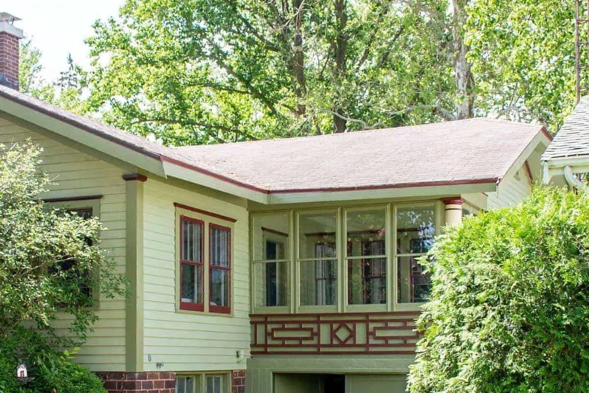 Photo of an older home with decorative details on the exterior. This is one of many design lessons new houses can learn from older homes. 