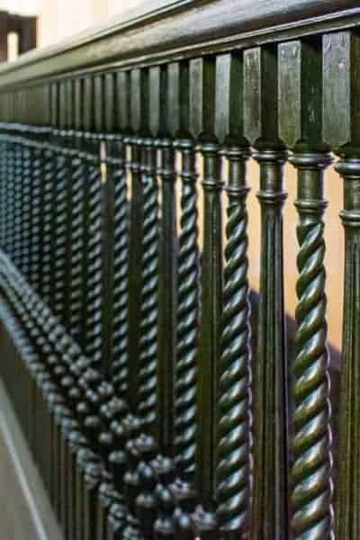 Photo of ornate black stairway spindles that would be perfect in new houses.