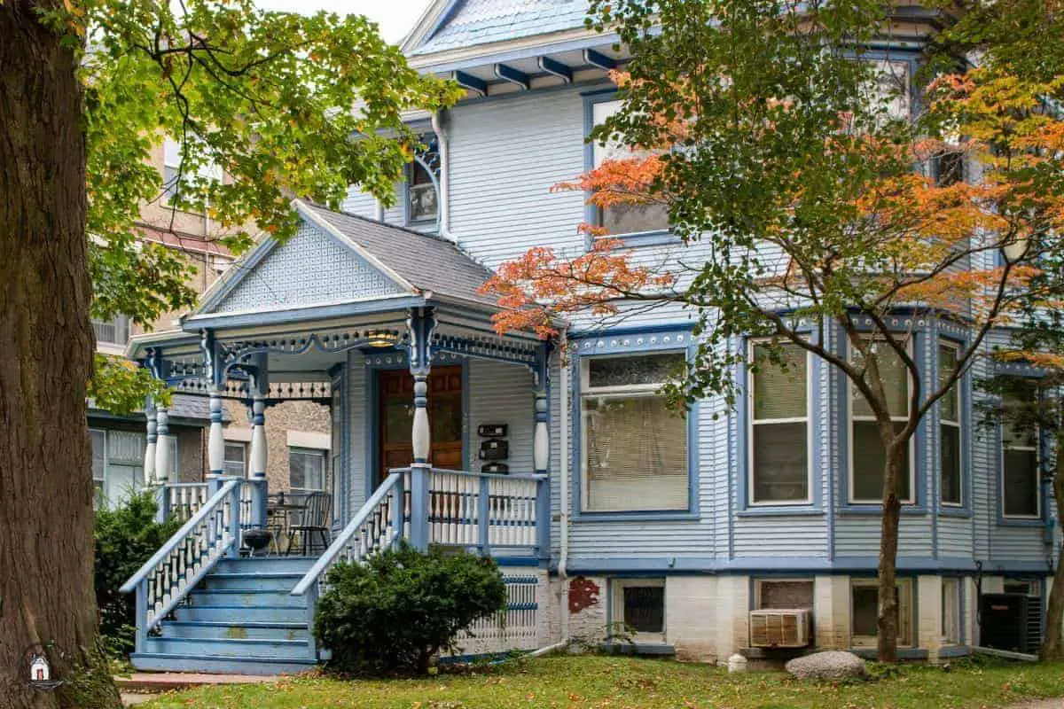 Photo of blue Victorian era home with a large porch, exemplifying one of many lessons for new houses.
