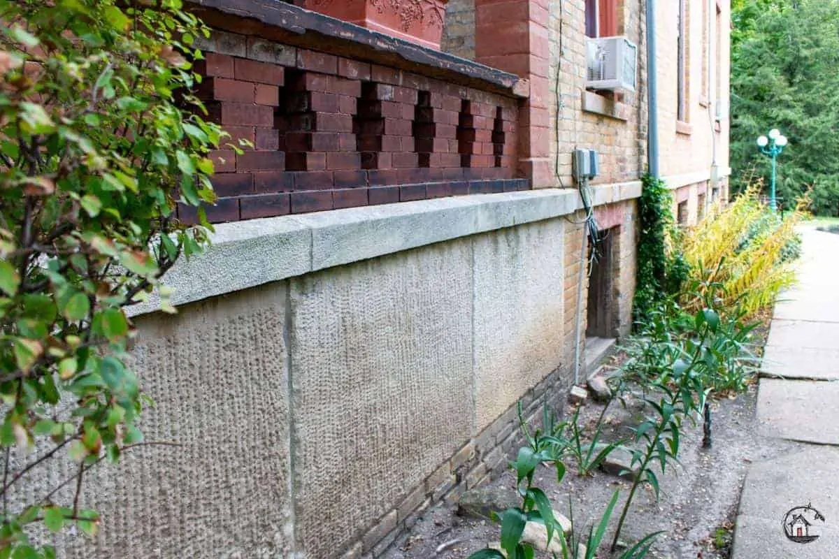 Photo of stone water table on an old house, representing a valuable lesson for new houses. 